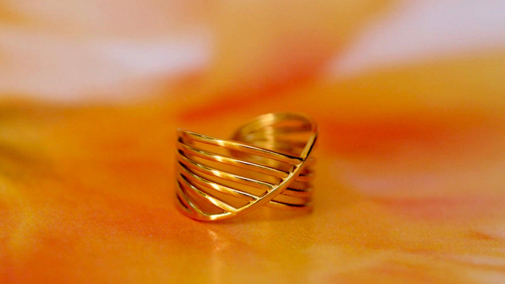 Cross over ring adjustable