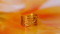 Cross over ring adjustable