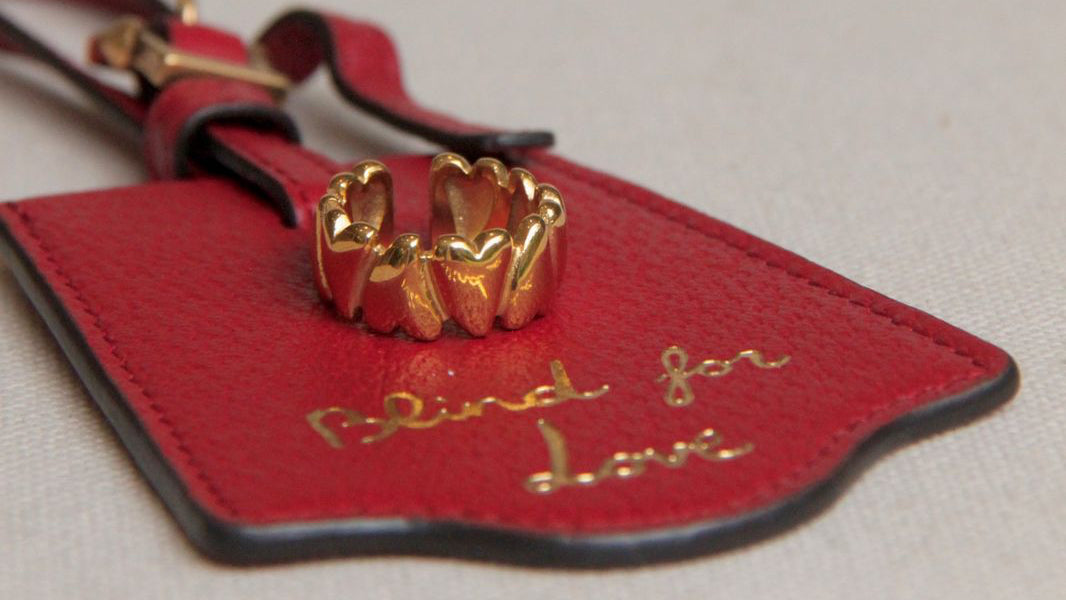 Alternating folded heart ring